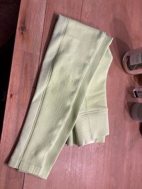 Pair of off-line leggings, women size, extra small, white, and lime green
